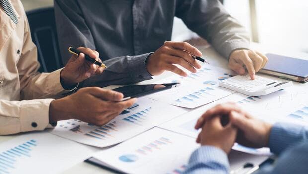 Consulting team reviewing performance data